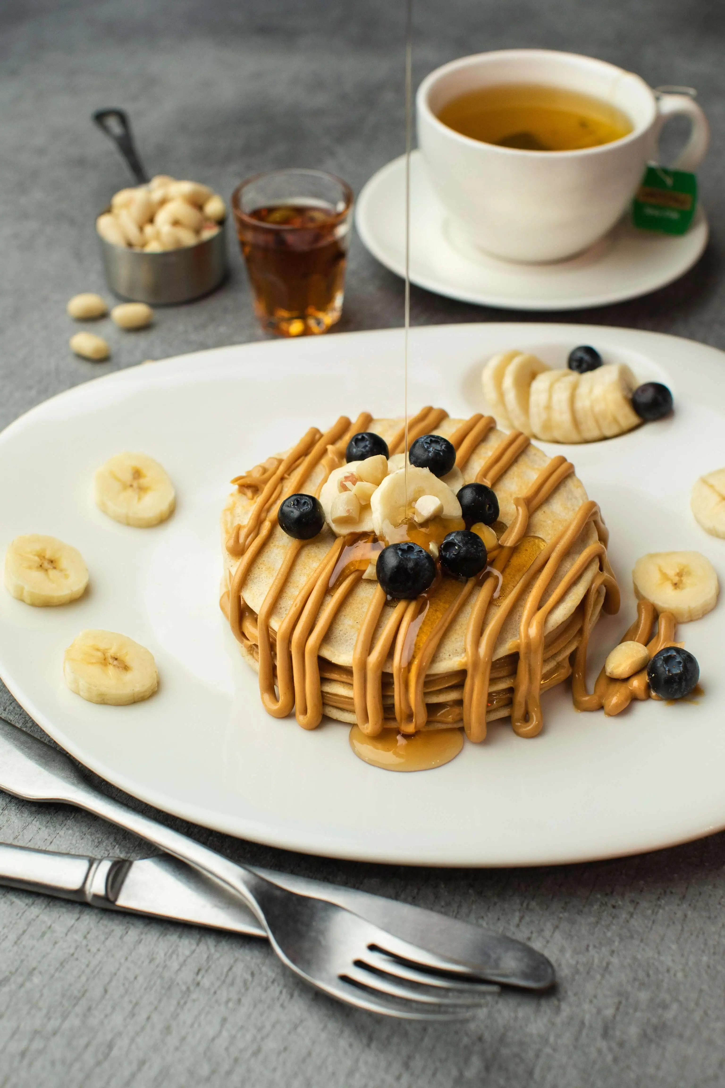 Banana Oatmeal Pancakes with Peanut Butter and blueberries